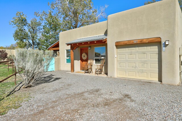 exterior space featuring gravel driveway