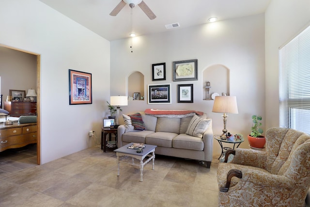 living area with visible vents and a ceiling fan