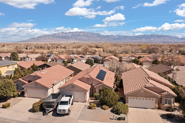 birds eye view of property featuring a mountain view and a residential view