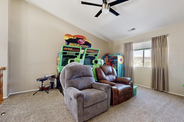 interior space featuring visible vents, baseboards, lofted ceiling, carpet flooring, and a ceiling fan