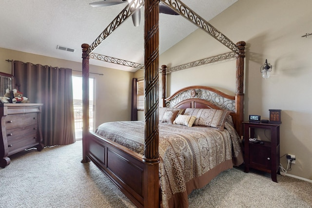 carpeted bedroom featuring visible vents, baseboards, a textured ceiling, and vaulted ceiling