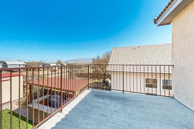 balcony featuring a mountain view