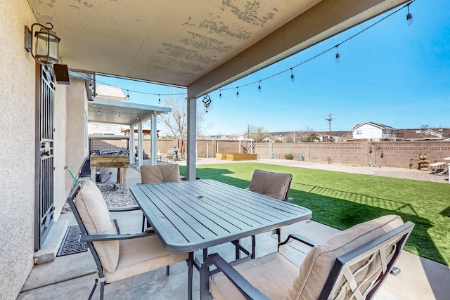 view of patio / terrace with outdoor dining area and a fenced backyard