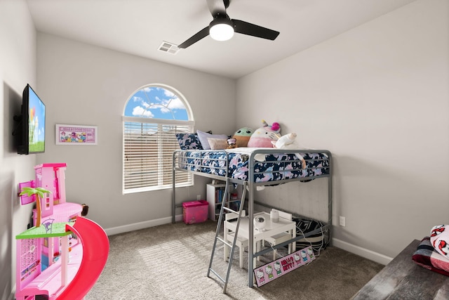 carpeted bedroom with a ceiling fan, baseboards, and visible vents