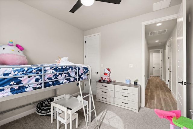 bedroom featuring recessed lighting, a ceiling fan, visible vents, light carpet, and baseboards
