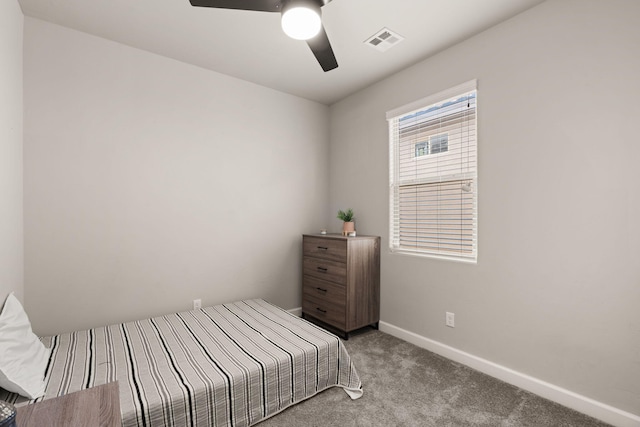 bedroom with visible vents, baseboards, a ceiling fan, and carpet floors