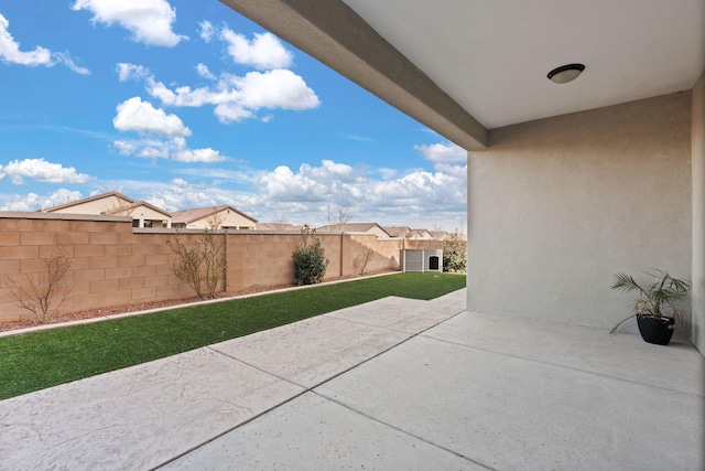 view of patio featuring fence
