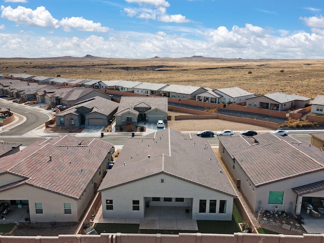 birds eye view of property featuring a mountain view and a residential view