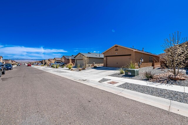 view of road featuring a residential view, curbs, and sidewalks