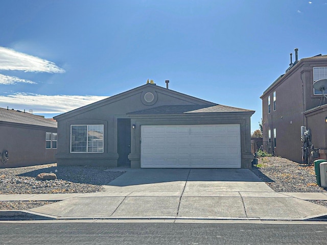 9312 Valle Vidal Pl SW, Albuquerque, NM 87121 - single story home featuring concrete driveway and an attached garage