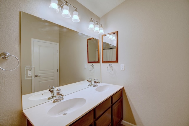 bathroom with double vanity and a sink