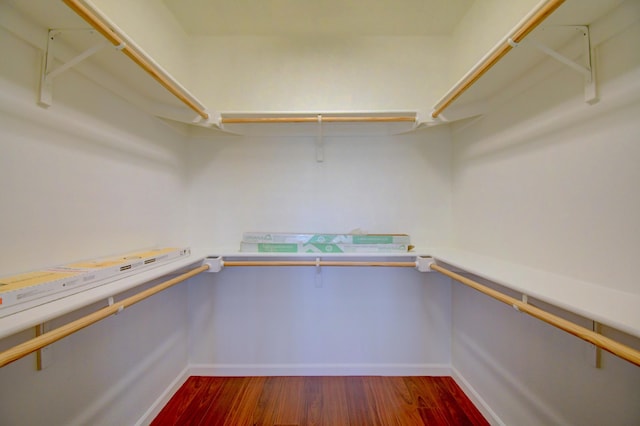 spacious closet with wood finished floors