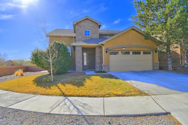 view of front facade featuring a front yard, an attached garage, stucco siding, concrete driveway, and stone siding