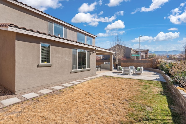 view of yard featuring a patio area, a mountain view, an outdoor hangout area, and a fenced backyard