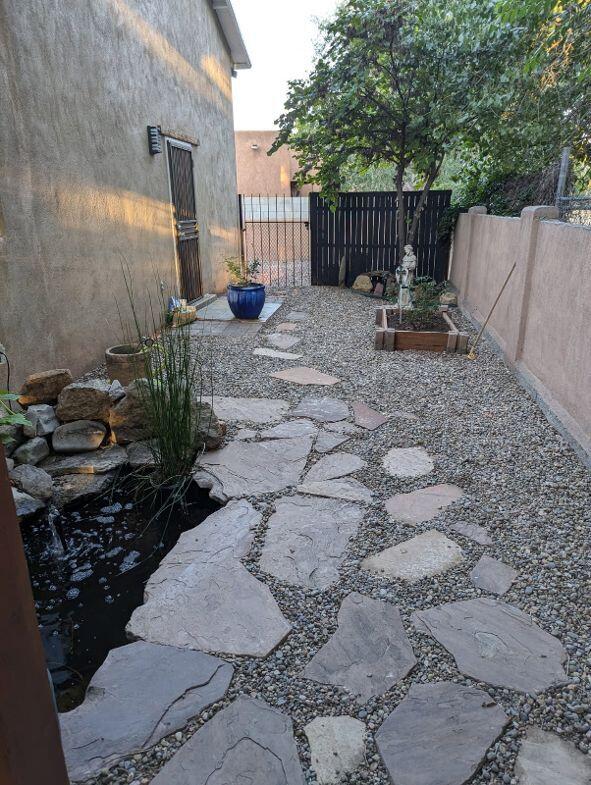 view of patio / terrace featuring a garden and fence