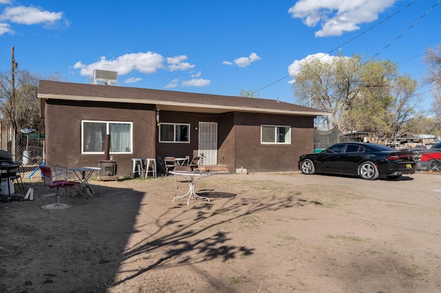 back of property with stucco siding