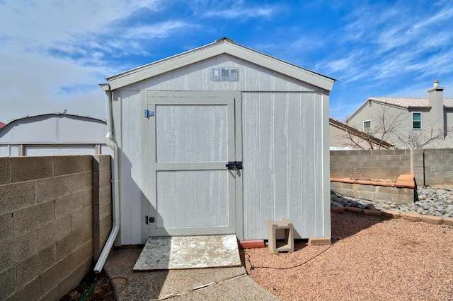 view of shed featuring a fenced backyard