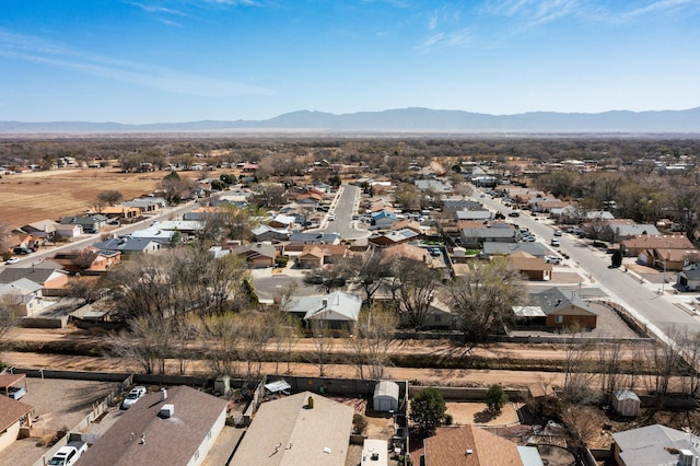 birds eye view of property with a mountain view and a residential view