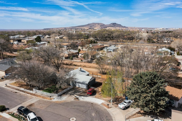 birds eye view of property featuring a mountain view and a residential view