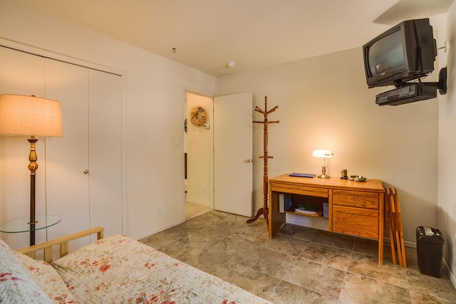 bedroom featuring baseboards