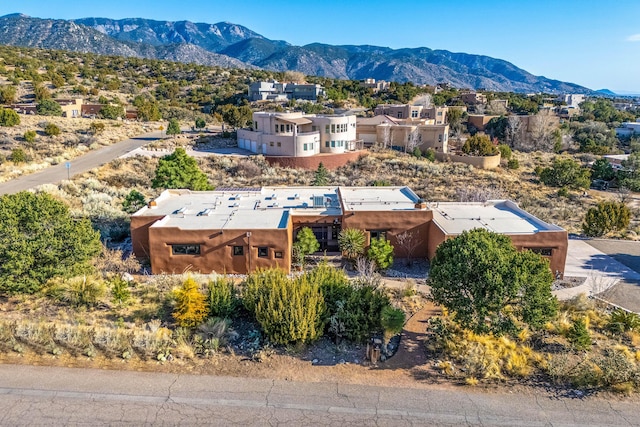 birds eye view of property with a mountain view