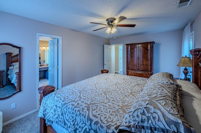 bedroom featuring visible vents, baseboards, ceiling fan, carpet flooring, and a textured ceiling