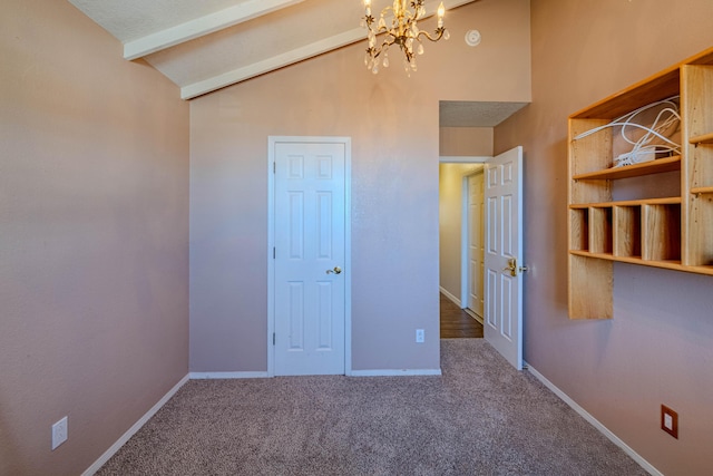 unfurnished bedroom featuring an inviting chandelier, vaulted ceiling with beams, baseboards, and carpet floors