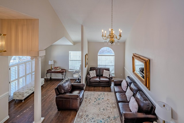 living room featuring baseboards, lofted ceiling, a notable chandelier, and dark wood-style floors