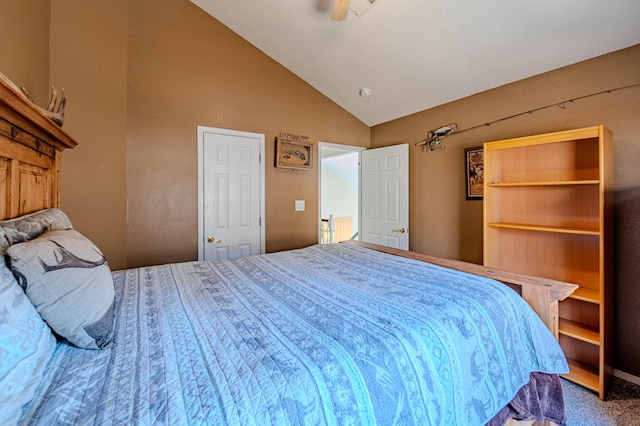 carpeted bedroom with lofted ceiling