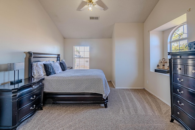 carpeted bedroom featuring visible vents, a ceiling fan, baseboards, and vaulted ceiling