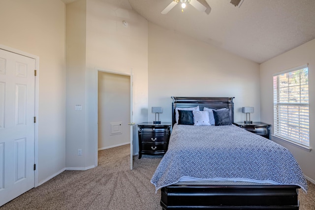 bedroom featuring a ceiling fan, carpet, baseboards, and high vaulted ceiling