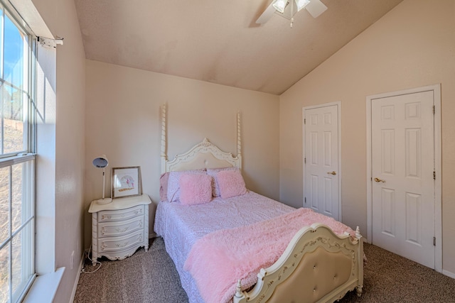 carpeted bedroom featuring a ceiling fan and vaulted ceiling