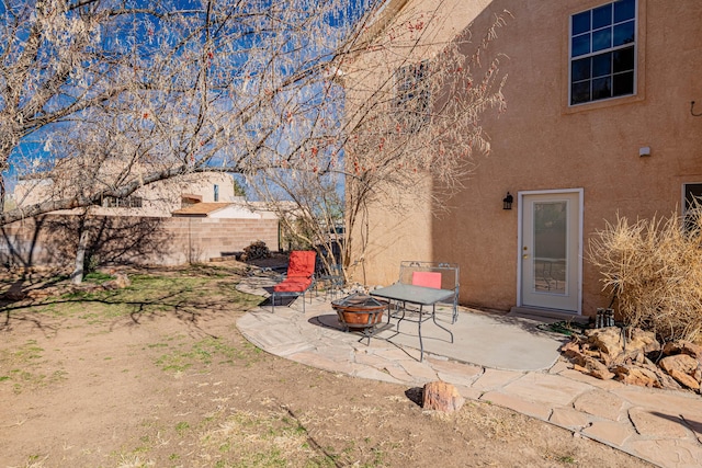 view of patio / terrace featuring an outdoor fire pit