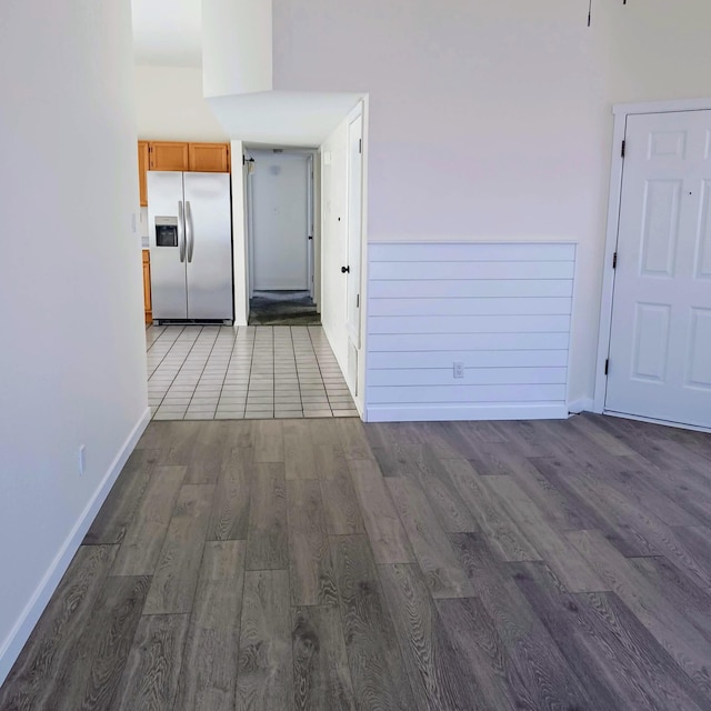 interior space with baseboards and wood finished floors