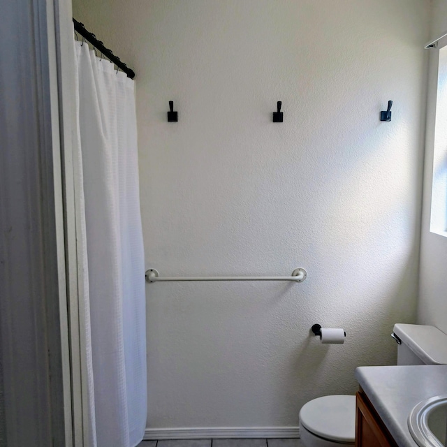 full bathroom with vanity, a shower with shower curtain, and toilet