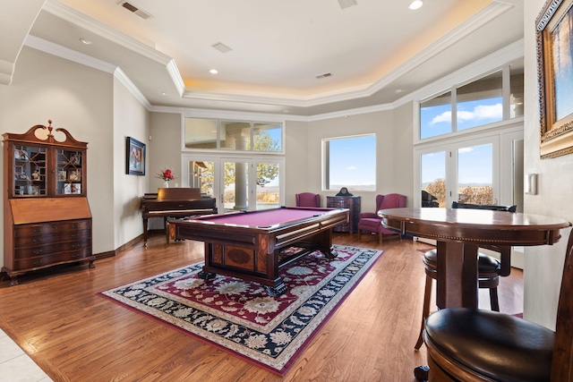 game room with visible vents, ornamental molding, wood finished floors, pool table, and a raised ceiling