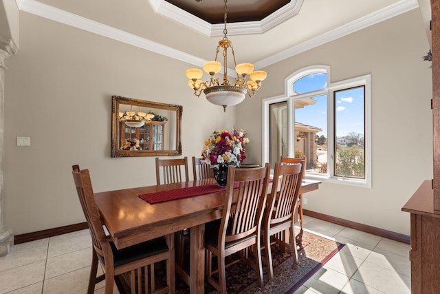 dining area featuring light tile patterned floors, a notable chandelier, crown molding, and a tray ceiling