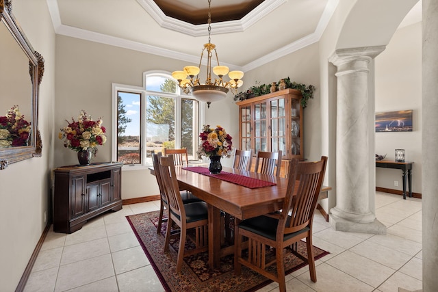 dining area featuring a notable chandelier, ornate columns, and ornamental molding