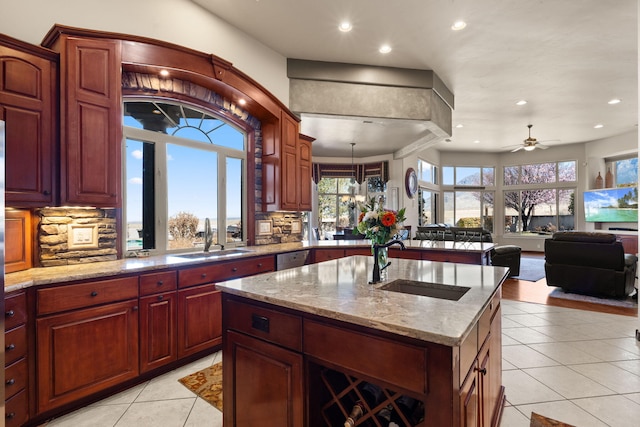 kitchen with light tile patterned flooring, recessed lighting, backsplash, and a sink