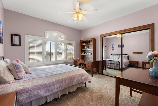 bedroom featuring a closet, carpet, and ceiling fan