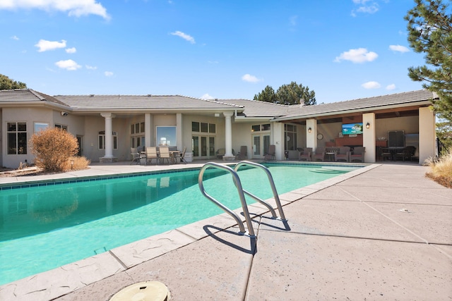 pool featuring a patio area and french doors