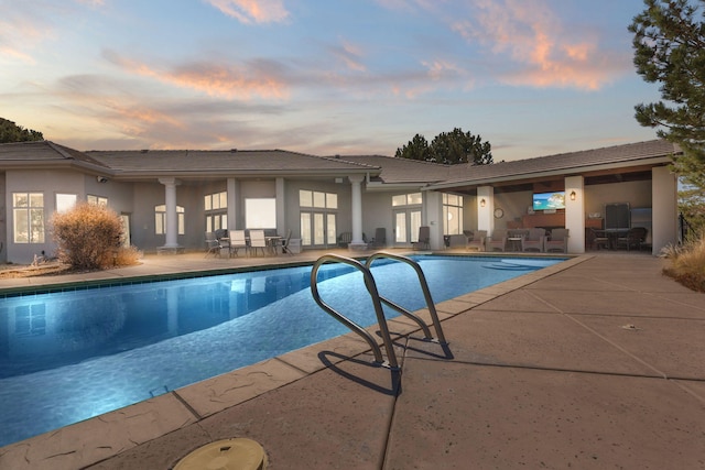 pool with a patio