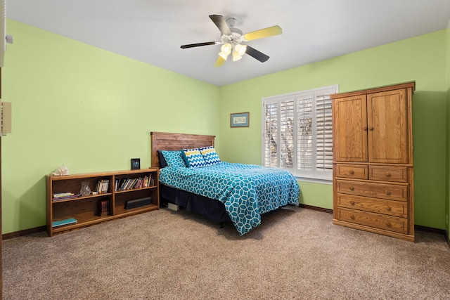 bedroom featuring carpet flooring, a ceiling fan, and baseboards