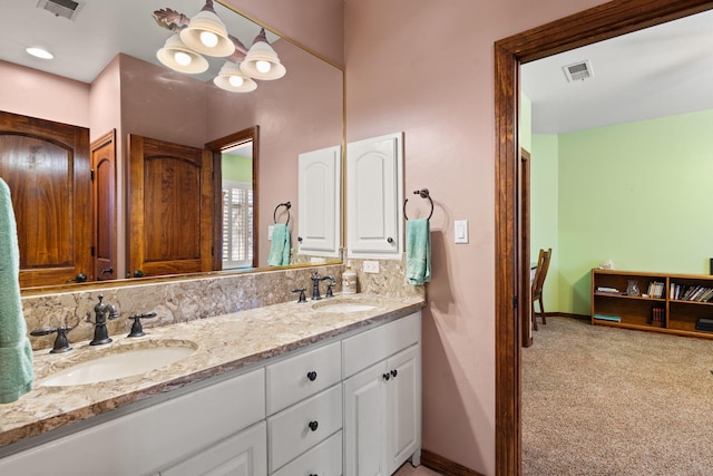 full bathroom featuring visible vents, baseboards, and a sink