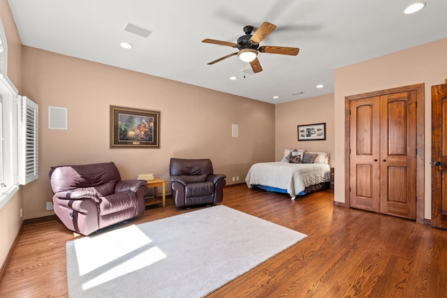 bedroom with recessed lighting, baseboards, and wood finished floors