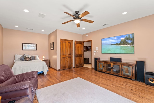 bedroom featuring visible vents, recessed lighting, a ceiling fan, and wood finished floors