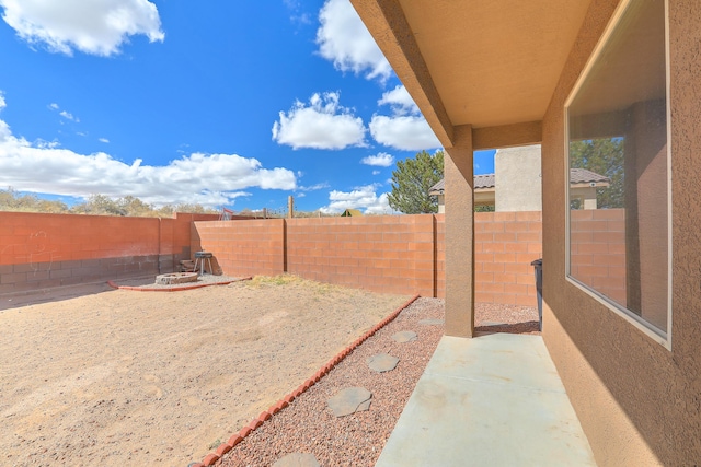 view of yard featuring a fenced backyard and a patio area