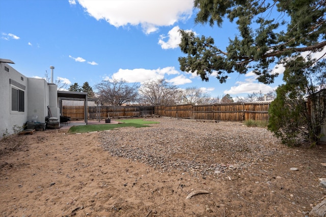 view of yard with a patio area and a fenced backyard