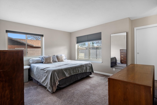 bedroom with carpet flooring and baseboards