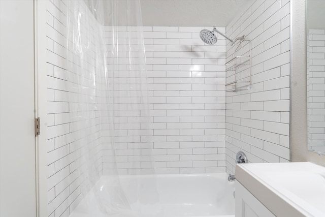 bathroom with vanity and shower / washtub combination